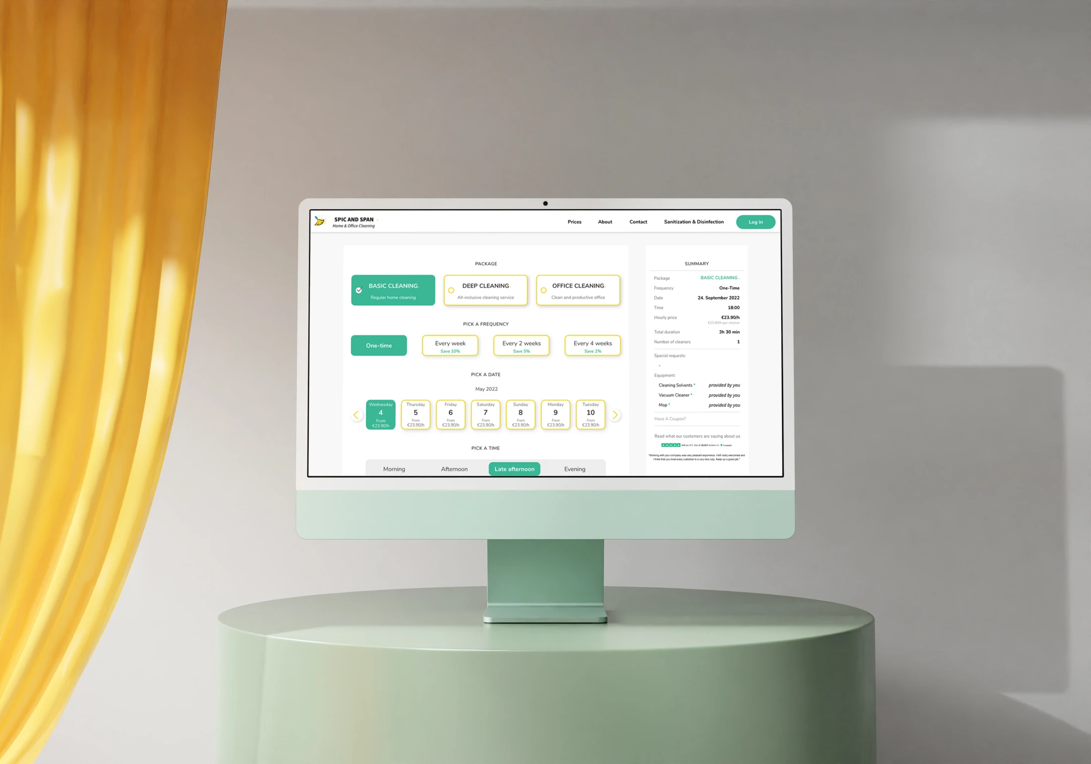 SPIC AND SPAN booking design on a mint-green desktop monitor